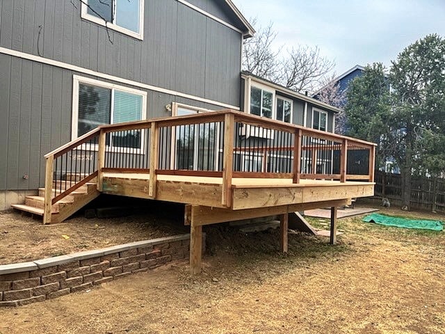 Large elevated cedar deck with metal railing system