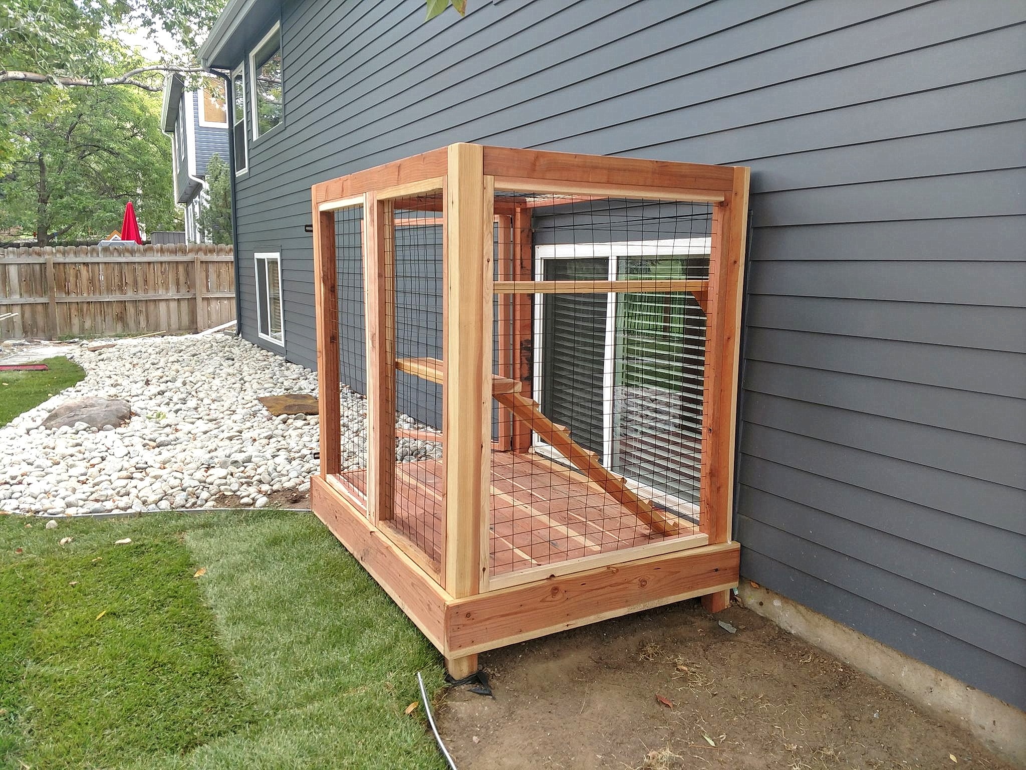 Freshly stained cedar fence